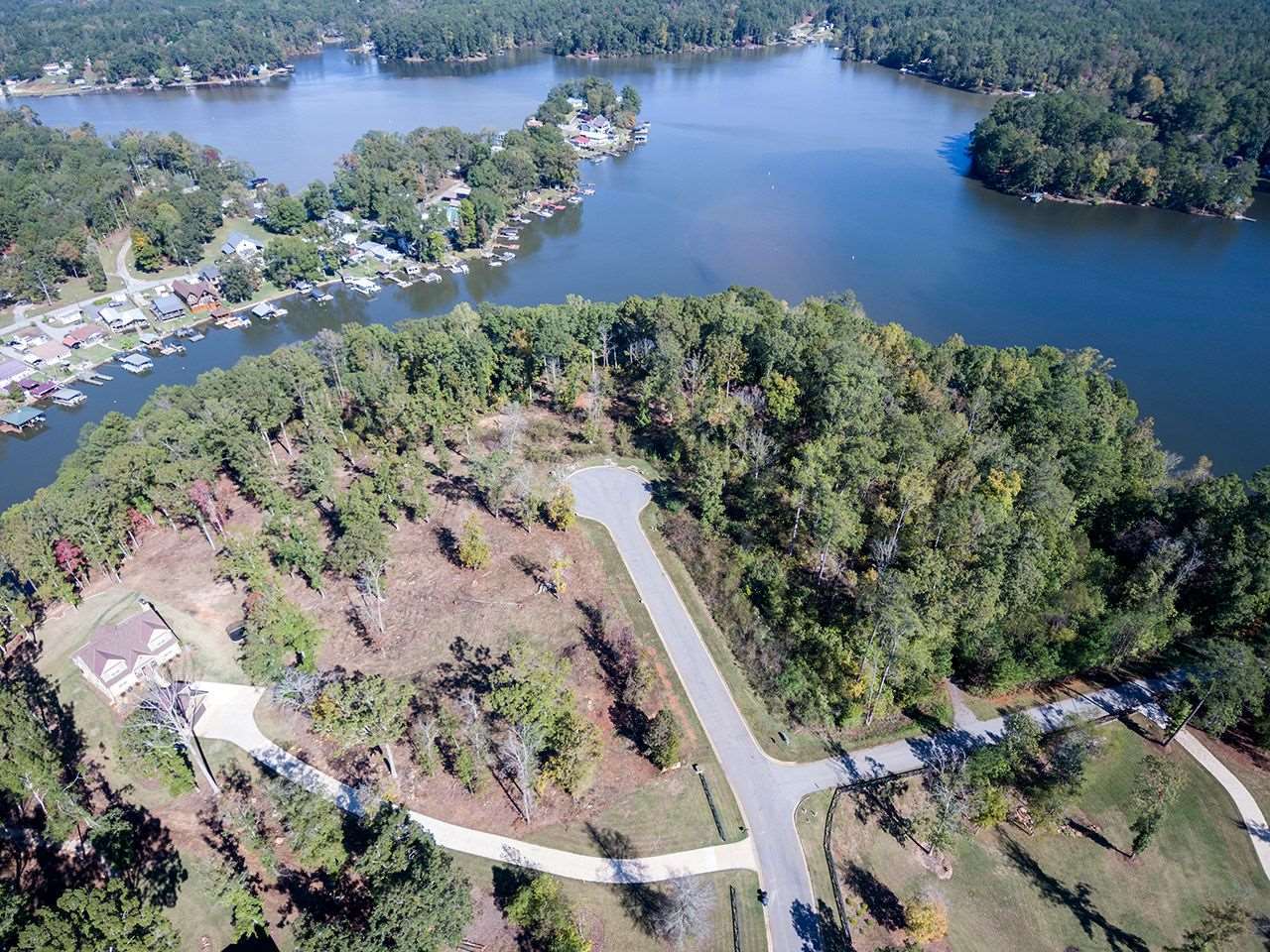 122 River Point Road, Unit LOT 25 Jackson, GA 30233 - Photo 4 of 5 an aerial view of a house with a yard and lake view