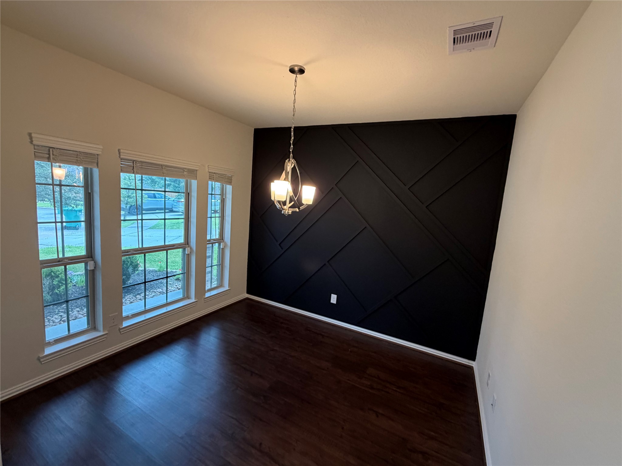 4706 Walnut Willow Ct Spring Spring, TX 77386 - Photo 4 of 17 an empty room with wooden floor and windows