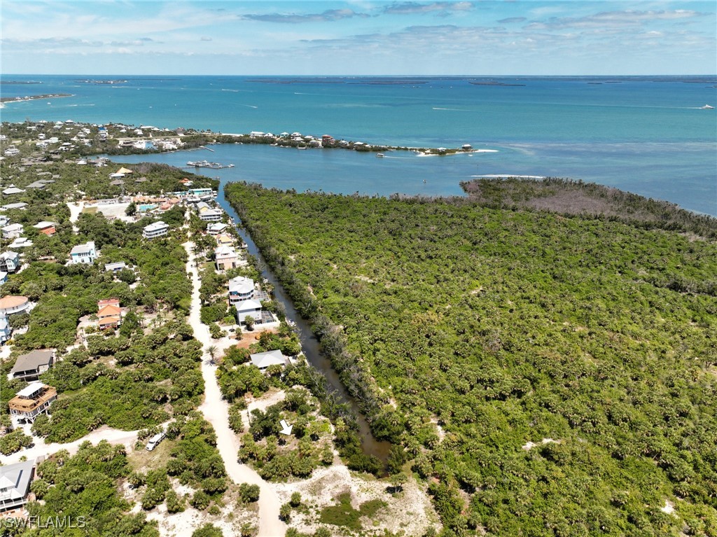 671 Rum Road Upper Captiva, FL 33924 - Photo 12 of 20 a view of a lake with a houses