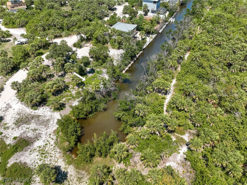 671 Rum Road Upper Captiva, FL 33924 - Photo 14 of 20 a view of a yard with a tree
