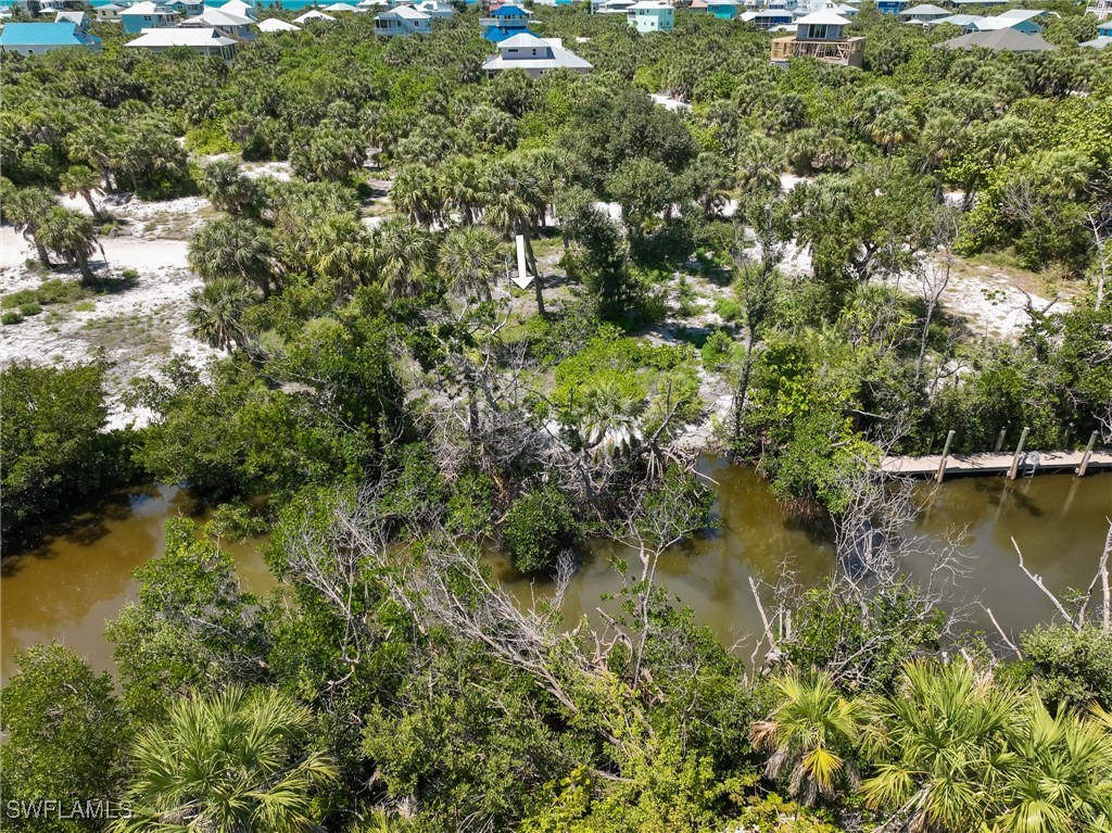 671 Rum Road Upper Captiva, FL 33924 - Photo 17 of 20 an aerial view of residential house with outdoor space and trees all around