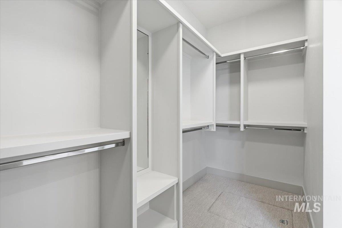 6762 South Messner Way Meridian, ID 83642 - Photo 20 of 35 Custom closet system featuring white shelving and chrome hanging rods