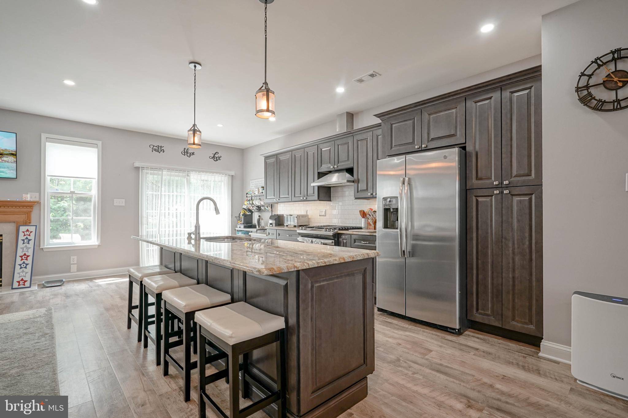 4 Compass Circle Mount Laurel, NJ 08054 - Photo 12 of 48 a kitchen with refrigerator a sink and chairs