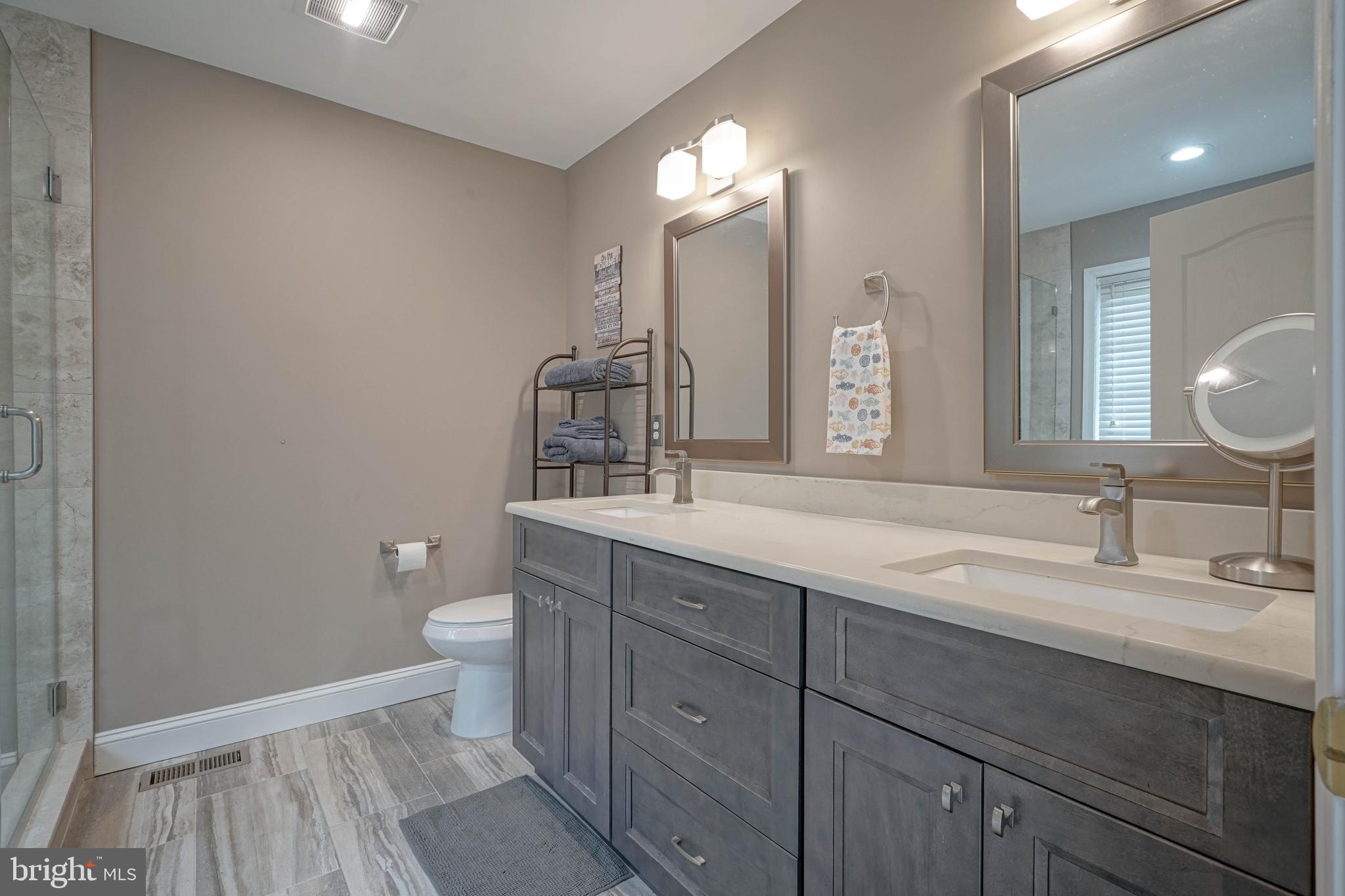 4 Compass Circle Mount Laurel, NJ 08054 - Photo 33 of 48 a bathroom with a double vanity sink and a mirror