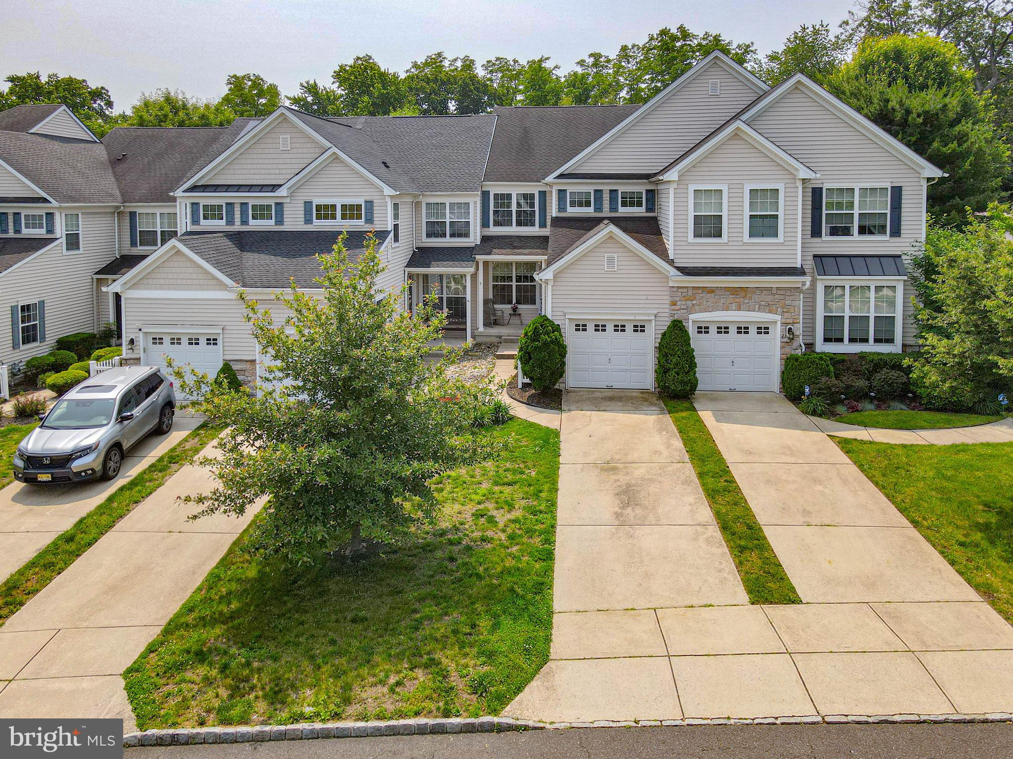 4 Compass Circle Mount Laurel, NJ 08054 - Photo 4 of 48 a front view of a house with a garden