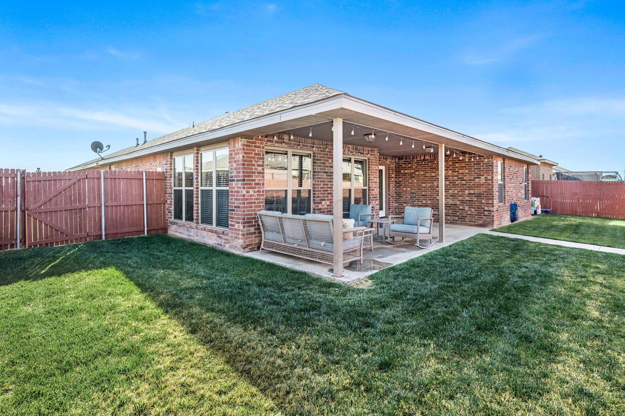 7302 Sinclair Street Amarillo, TX 79119 - Photo 20 of 21 Back Patio, Newly Stained Fence