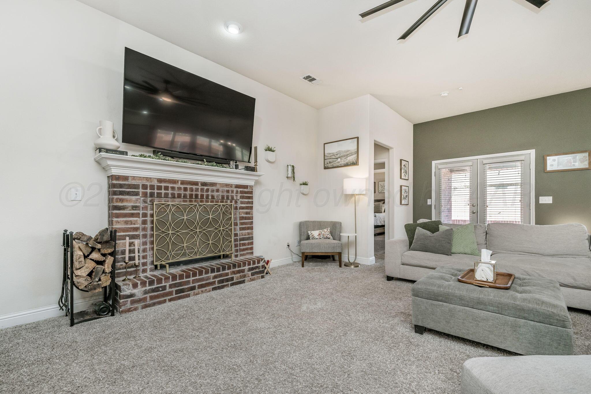 7302 Sinclair Street Amarillo, TX 79119 - Photo 4 of 21 Living Room, Wood Burning Fireplace