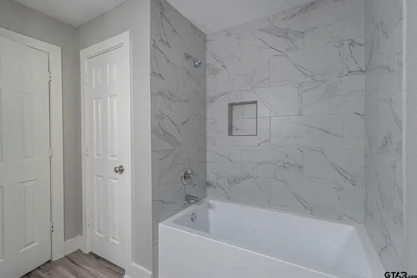 a bathroom with a bathtub