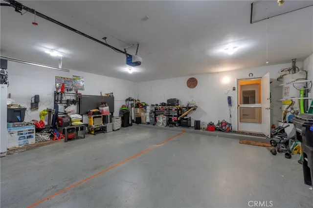 a view of a garage with a bike and car