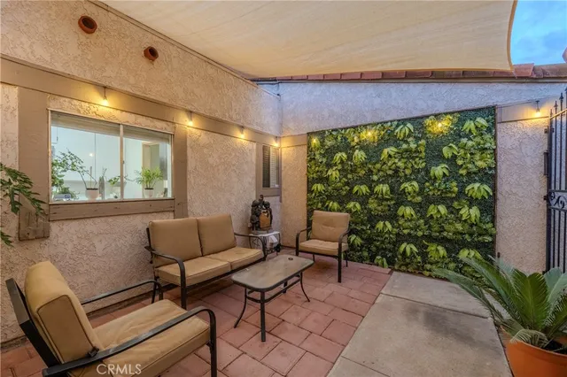 a outdoor living space with furniture and garden view