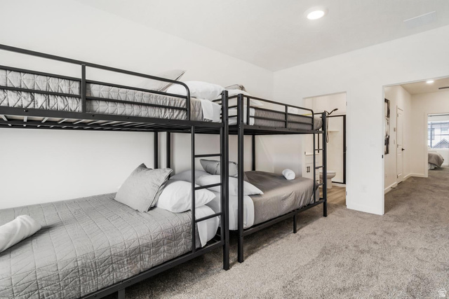 1705 Ripple Rock Drive, Unit 3017 Washington, UT 84780 - Photo 13 of 22 Room featuring a metal bunk bed frame with a ladder, light gray carpet flooring, white walls, and recessed lighting