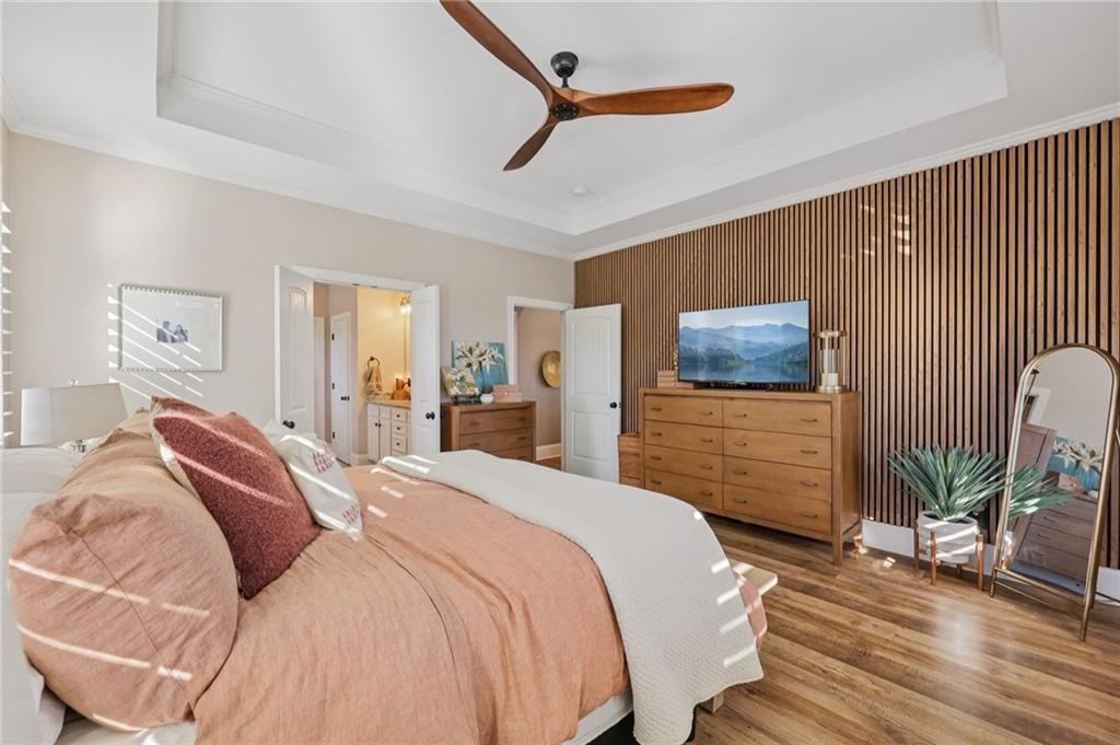 602 Red Leaf Way Canton, GA 30114 - Photo 11 of 40 a bedroom with a bed and a flat screen tv