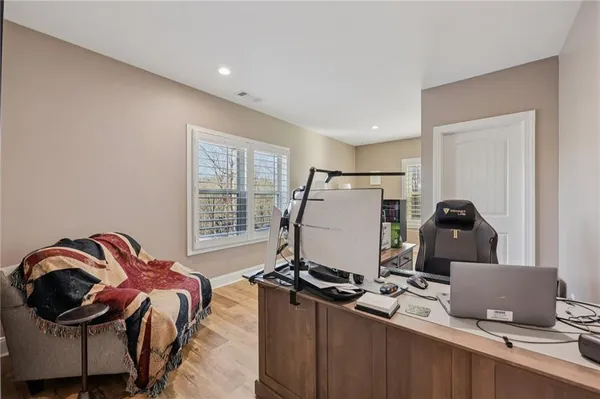 a room with a bed and a desk