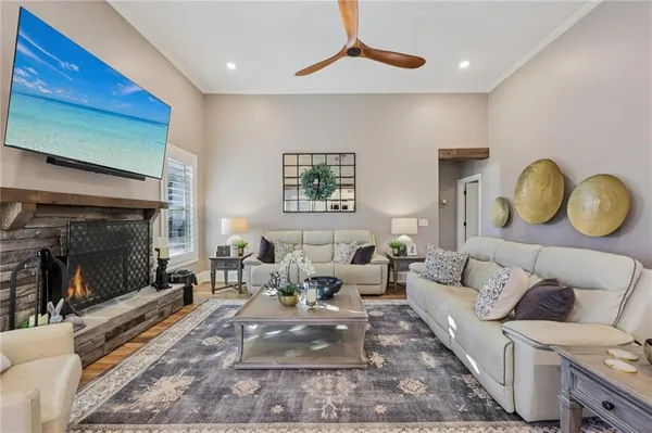 a living room with furniture and a fireplace