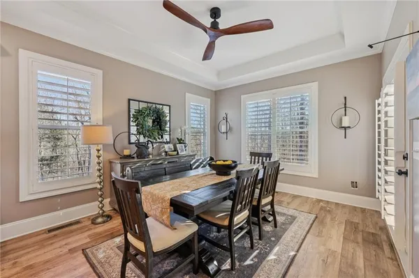 a dining room with furniture and window