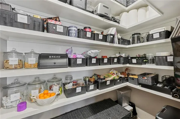 a kitchen with lots of clutter and cabinets
