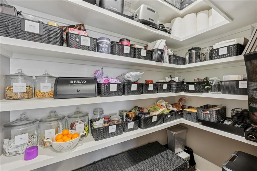 602 Red Leaf Way Canton, GA 30114 - Photo 9 of 40 a kitchen with lots of clutter and cabinets