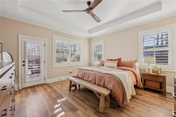 a bedroom with a large bed and a window