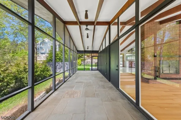 a view of a room with a large window