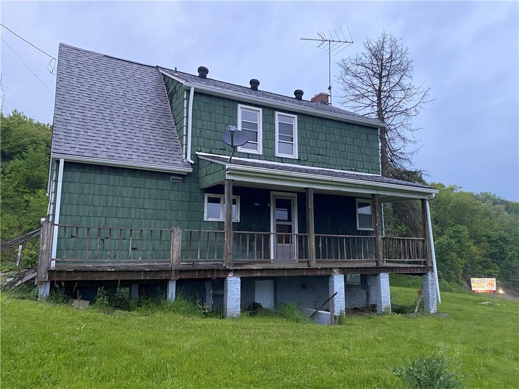 333 Freeport Road Freeport, PA 16229 - Photo 3 of 13 a view of house with a yard and deck