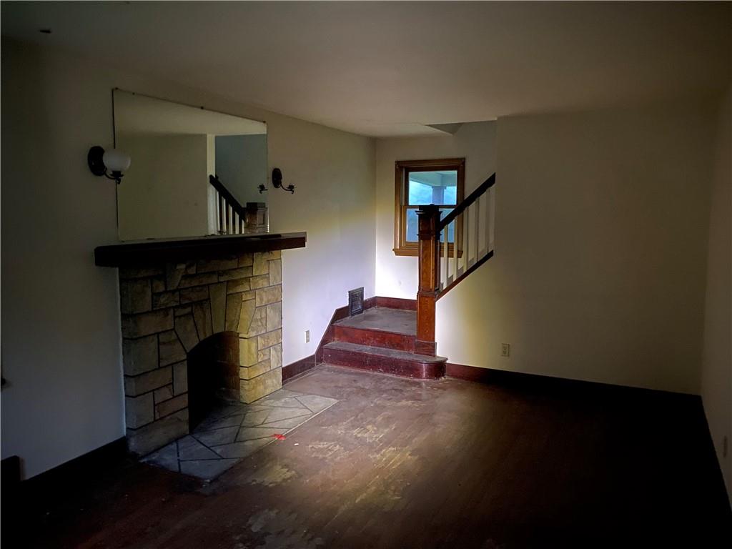 333 Freeport Road Freeport, PA 16229 - Photo 5 of 13 a living room with furniture and a fireplace