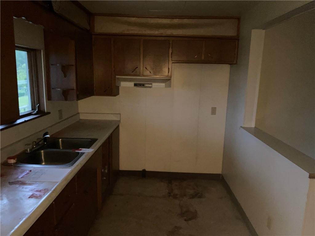 333 Freeport Road Freeport, PA 16229 - Photo 8 of 13 a kitchen with a sink and a refrigerator
