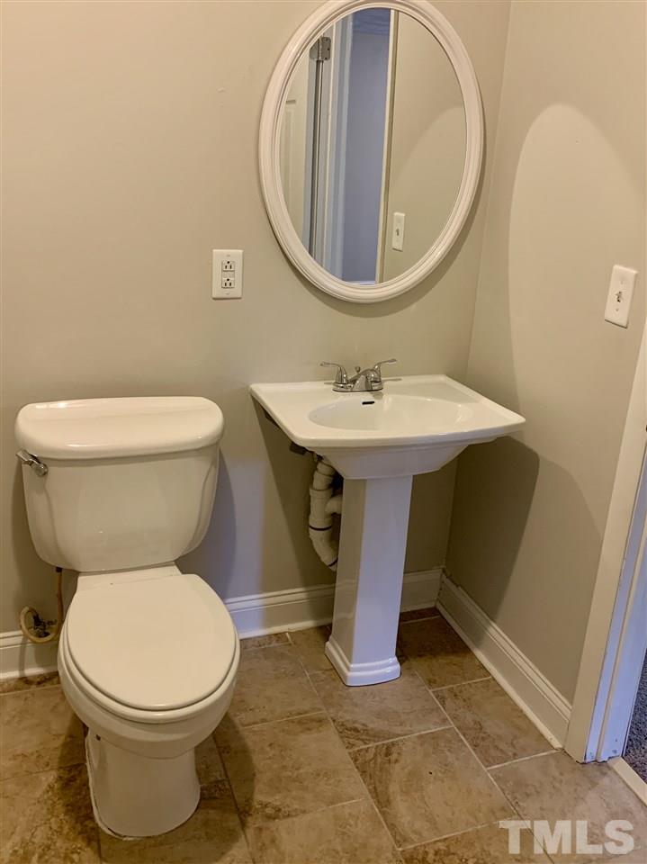 670 Anderson Road Linden, NC 28356 - Photo 11 of 16 This hall bathroom features a shower over tub with a tiled floor