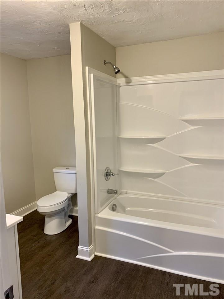670 Anderson Road Linden, NC 28356 - Photo 7 of 16 New flooring, new cabinets, new toilet, new bath/shower surround