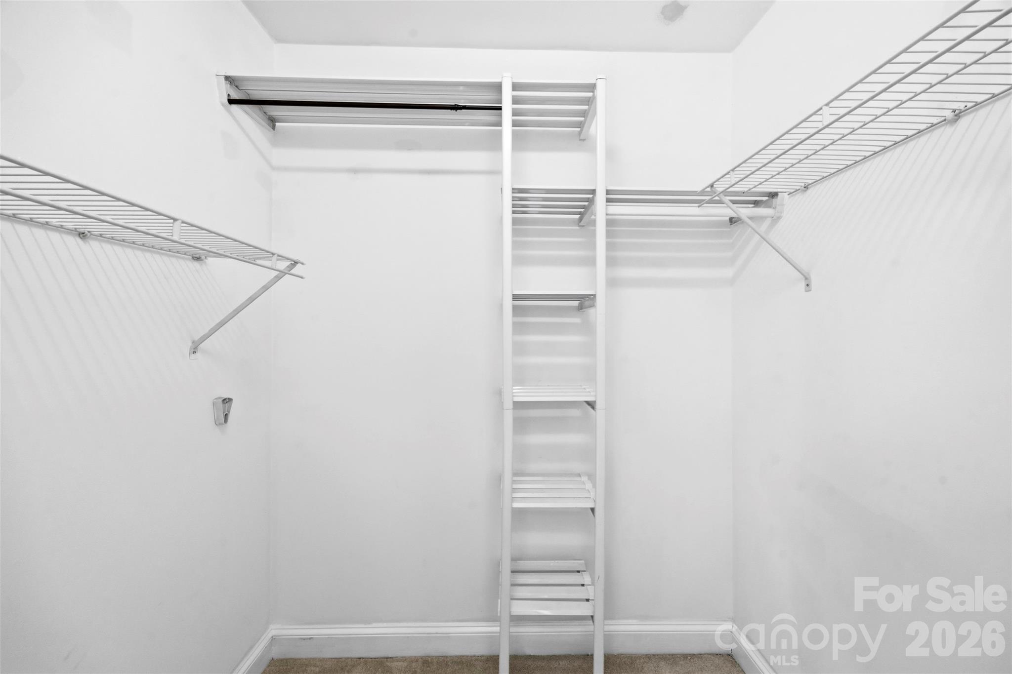 813 Rothmoor Drive Northeast Concord, NC 28025 - Photo 16 of 35 a view of walk in closet with empty racks