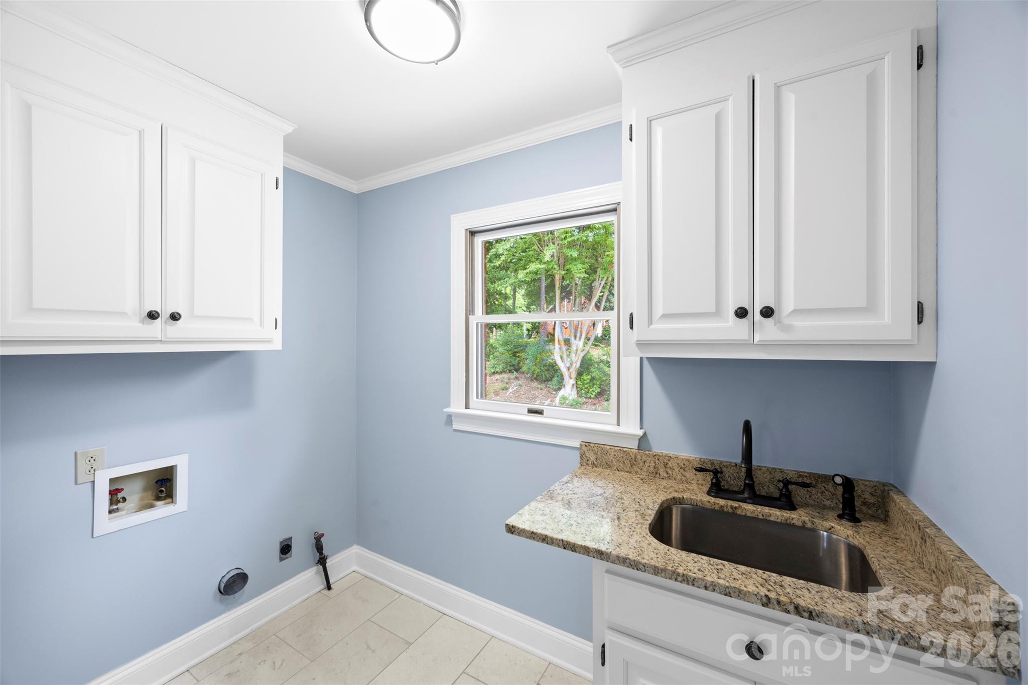 813 Rothmoor Drive Northeast Concord, NC 28025 - Photo 23 of 35 a kitchen with a sink and cabinets
