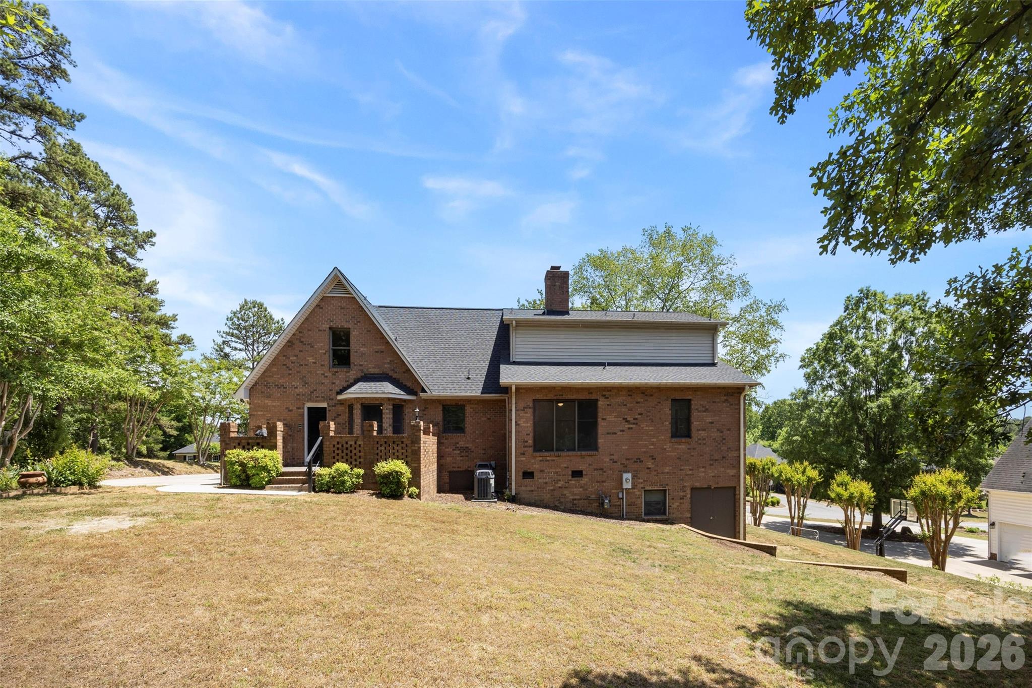 813 Rothmoor Drive Northeast Concord, NC 28025 - Photo 30 of 35 a front view of a house with a yard and garage