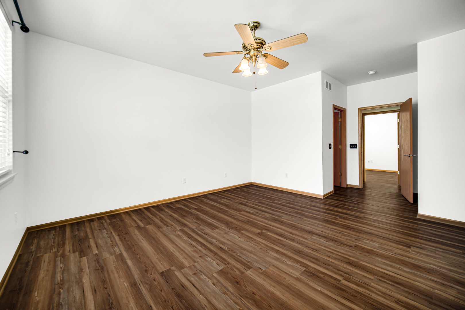 690 Wellston Lane Romeoville, IL 60446 - Photo 13 of 22 a view of empty room with wooden floor