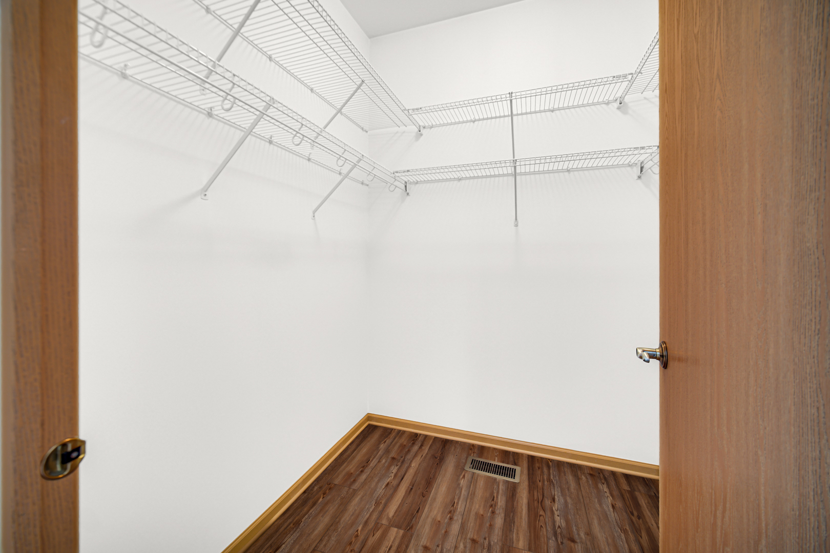 690 Wellston Lane Romeoville, IL 60446 - Photo 14 of 22 a view of a room with racks on the wall