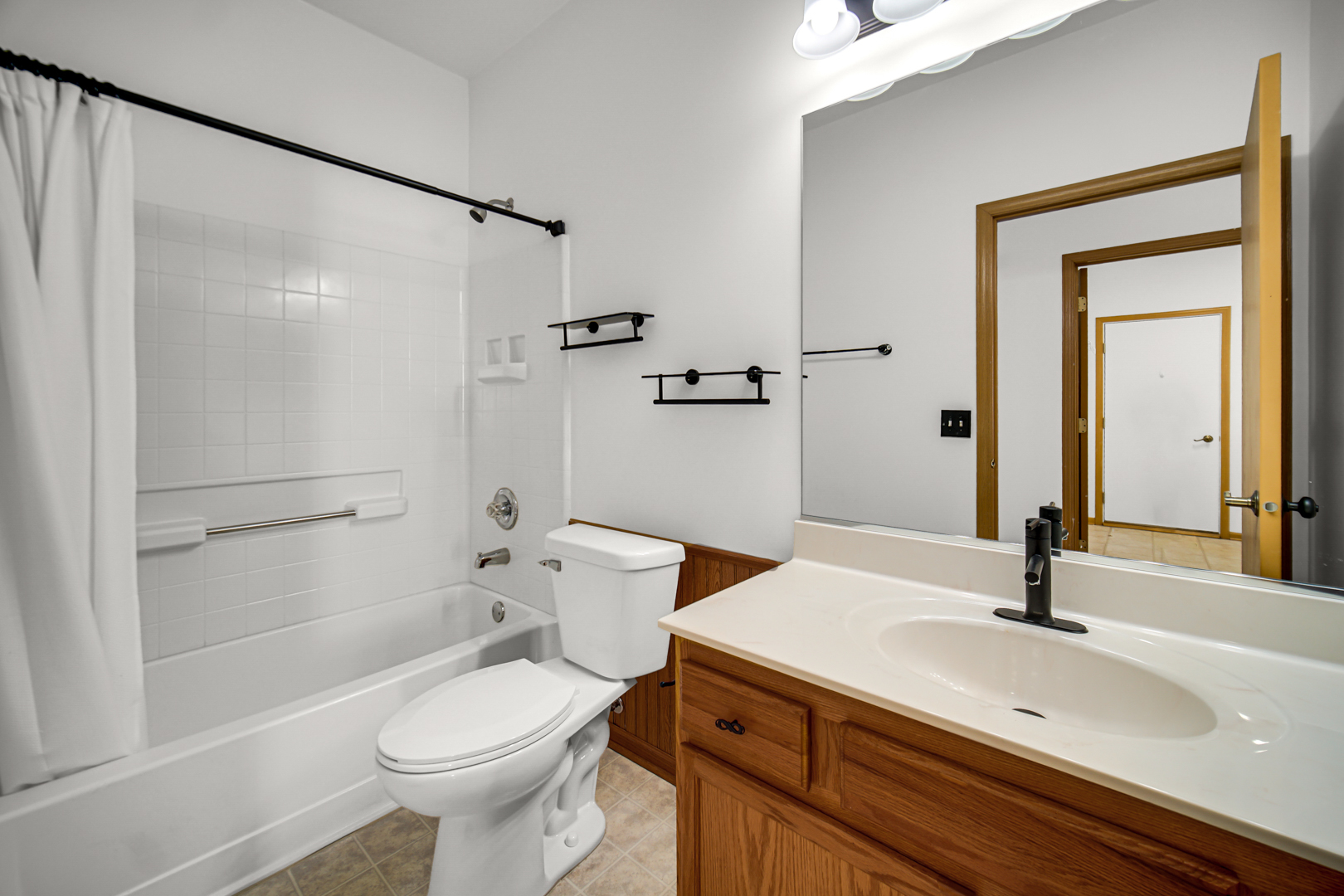690 Wellston Lane Romeoville, IL 60446 - Photo 18 of 22 a bathroom with a sink toilet and shower