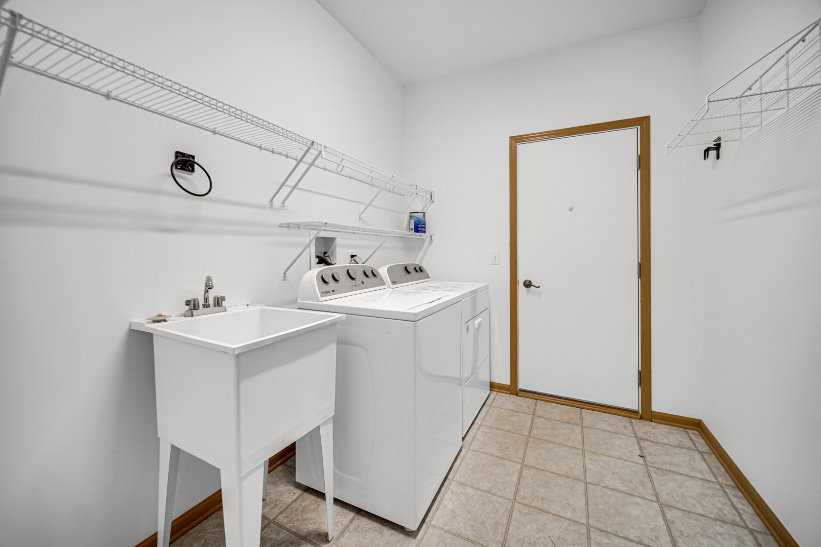 690 Wellston Lane Romeoville, IL 60446 - Photo 19 of 22 a utility room with cabinets washer and dryer
