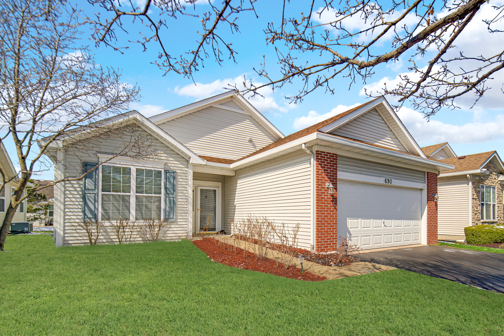690 Wellston Lane Romeoville, IL 60446 - Photo 2 of 22 a view of a house with a yard and large tree
