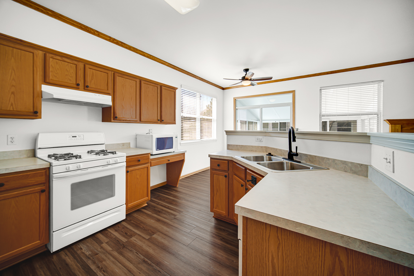 690 Wellston Lane Romeoville, IL 60446 - Photo 7 of 22 a kitchen with stainless steel appliances a stove a sink and a refrigerator