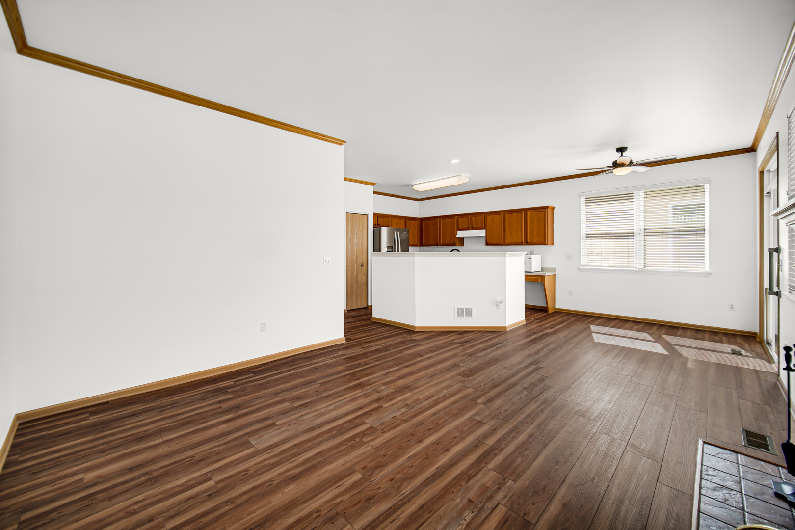 690 Wellston Lane Romeoville, IL 60446 - Photo 9 of 22 a view of empty room with wooden floor and fan