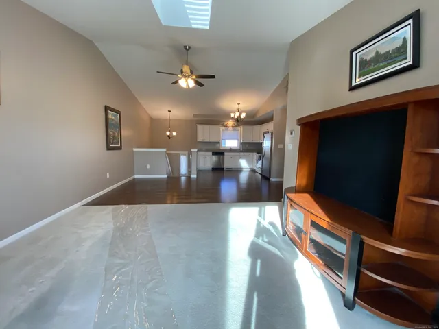 a view of kitchen with furniture and flat screen tv