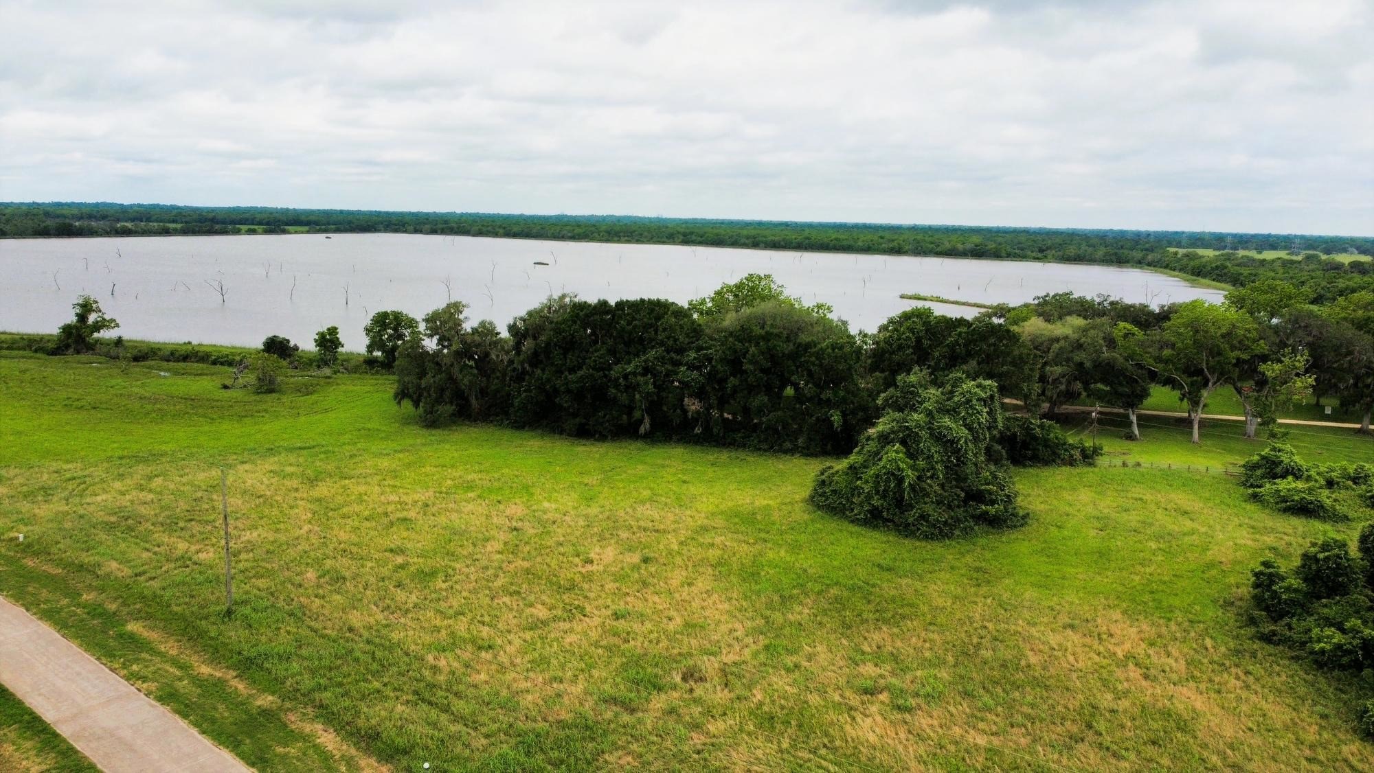 118 Pony Trail Angleton, TX 77515 - Photo 1 of 20 a lake with a city view