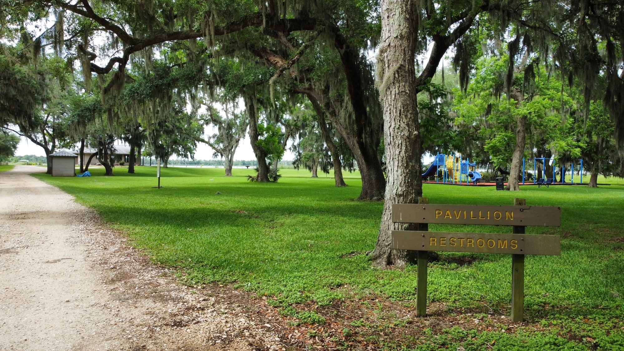118 Pony Trail Angleton, TX 77515 - Photo 2 of 20 a garden with trees in the background