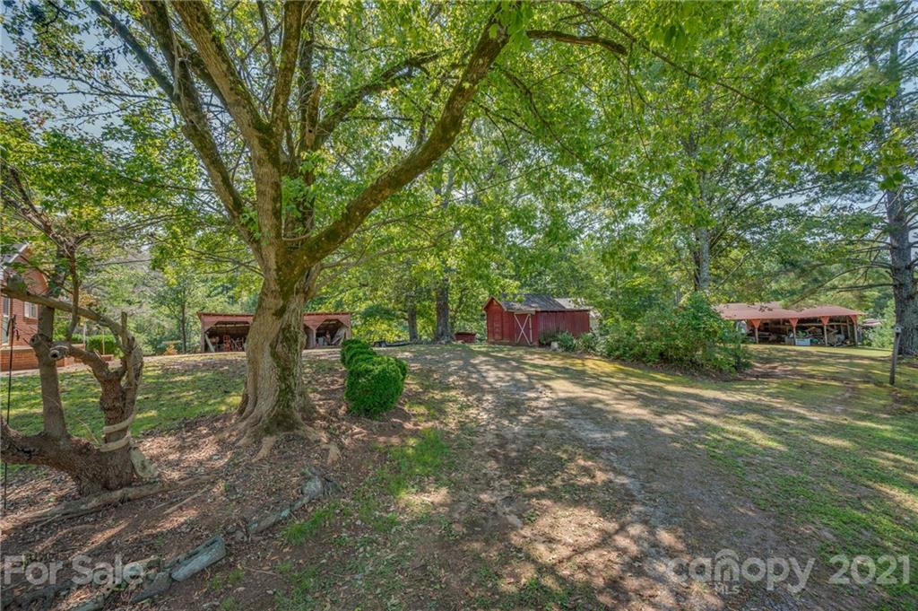 2330 Polk County Line Road Rutherfordton, NC 28139 - Photo 14 of 47 a backyard of a house with lots of green space