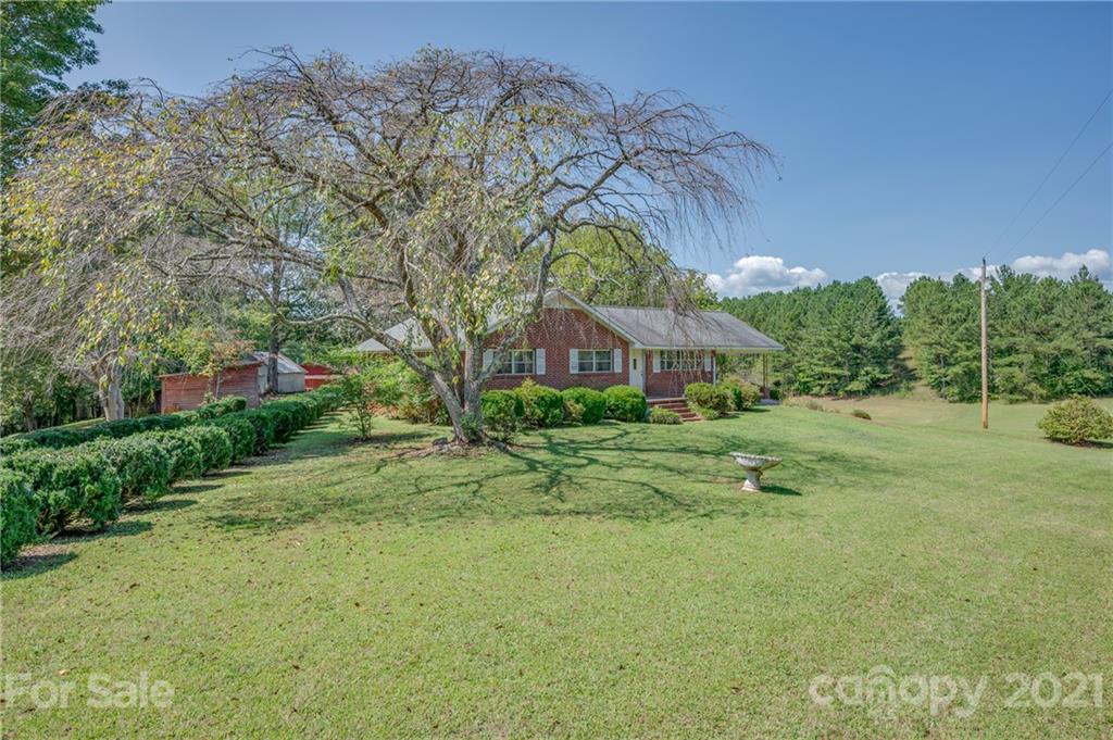 2330 Polk County Line Road Rutherfordton, NC 28139 - Photo 26 of 47 a backyard of a house with table and chairs