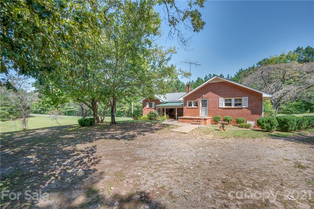 2330 Polk County Line Road Rutherfordton, NC 28139 - Photo 4 of 47 a front view of a house with a yard