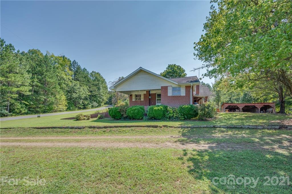 2330 Polk County Line Road Rutherfordton, NC 28139 - Photo 31 of 47 a front view of a house with a yard
