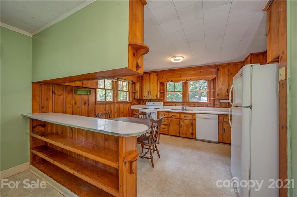 2330 Polk County Line Road Rutherfordton, NC 28139 - Photo 39 of 47 a kitchen with a sink cabinets and stainless steel appliances
