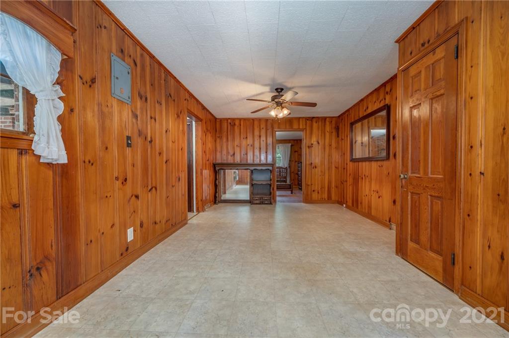 2330 Polk County Line Road Rutherfordton, NC 28139 - Photo 43 of 47 a view of a hallway with a chandelier