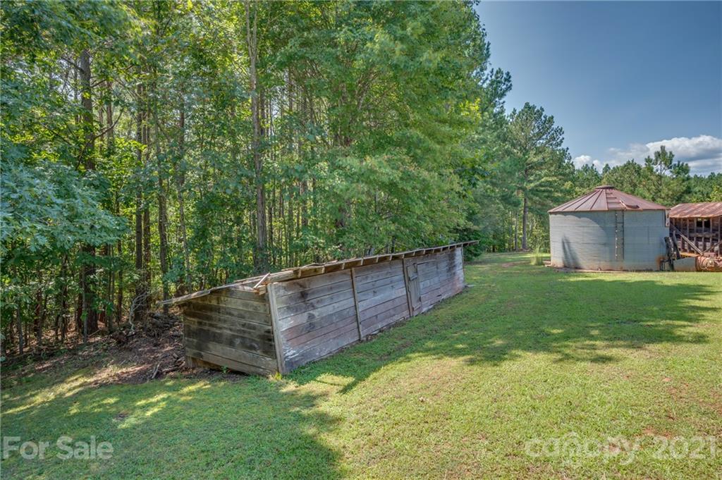 2330 Polk County Line Road Rutherfordton, NC 28139 - Photo 9 of 47 a view of a backyard with a garden