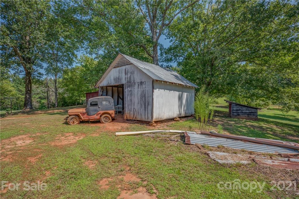 2330 Polk County Line Road Rutherfordton, NC 28139 - Photo 10 of 47 a view of a house with a yard and sitting area