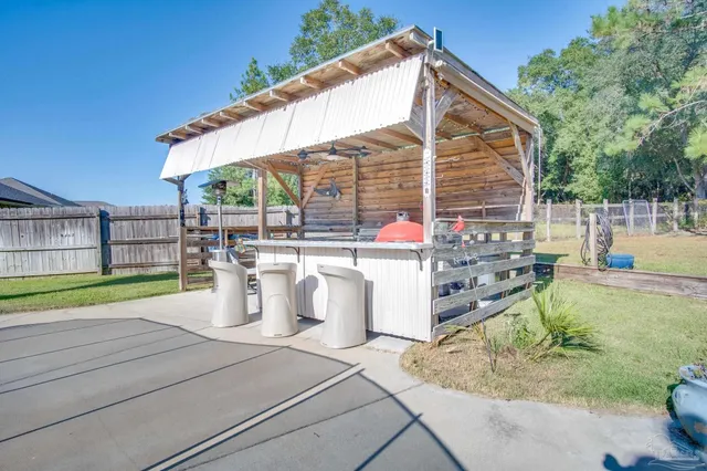 a view of a yard with a tree